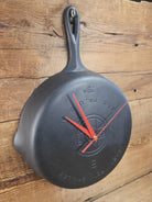 Custom made wall hanging Griswold Clock. Repurposed from cracked skillet. Comes with interchangeable clock mechanics.