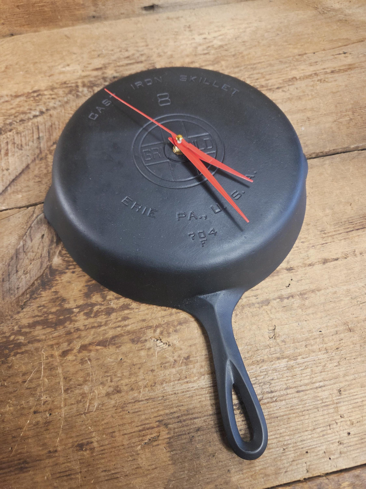 Custom made wall hanging Griswold Clock. Repurposed from cracked skillet. Comes with interchangeable clock mechanics.