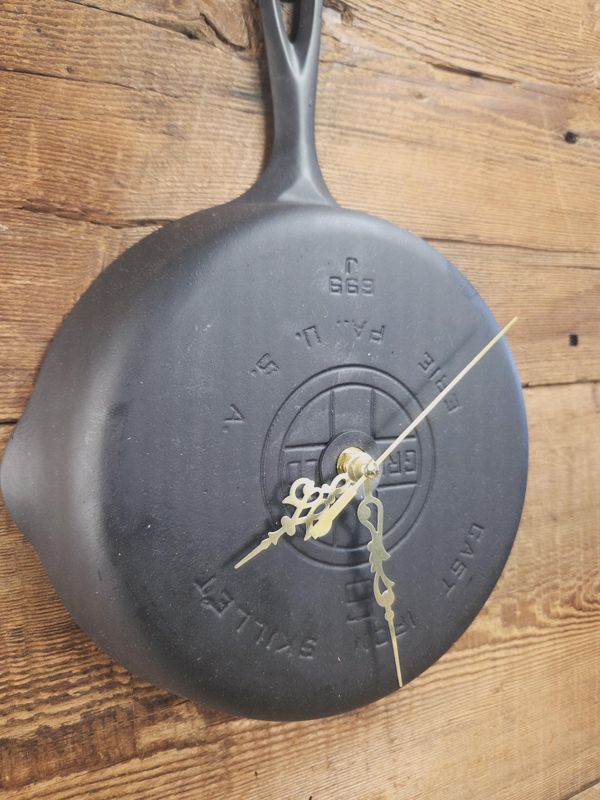 Custom made wall hanging Griswold Clock. Repurposed from cracked skillet. Comes with interchangeable clock mechanics.