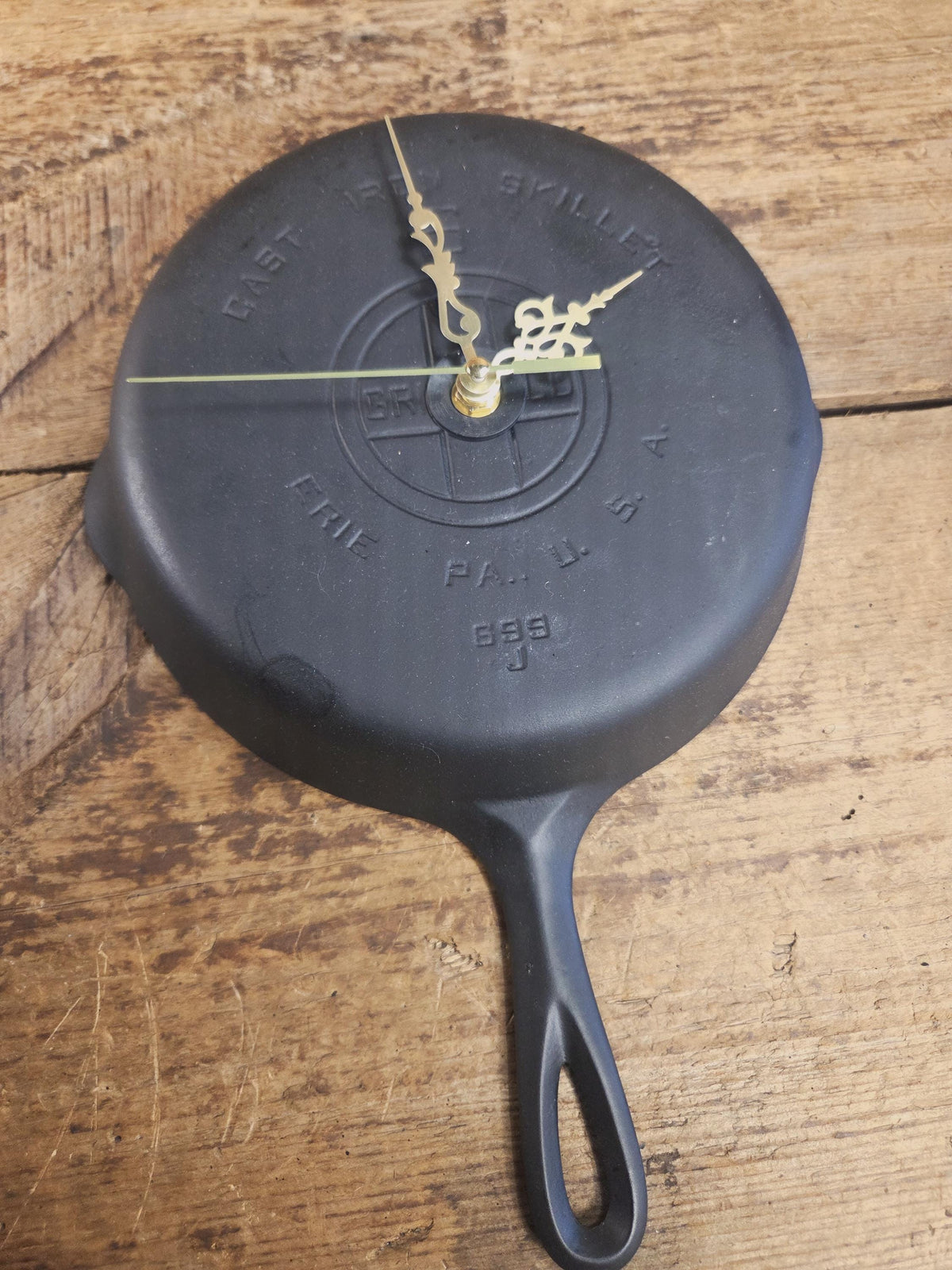 Custom made wall hanging Griswold Clock. Repurposed from cracked skillet. Comes with interchangeable clock mechanics.