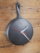 Custom made wall hanging Griswold Clock. Repurposed from cracked skillet. Comes with interchangeable clock mechanics.