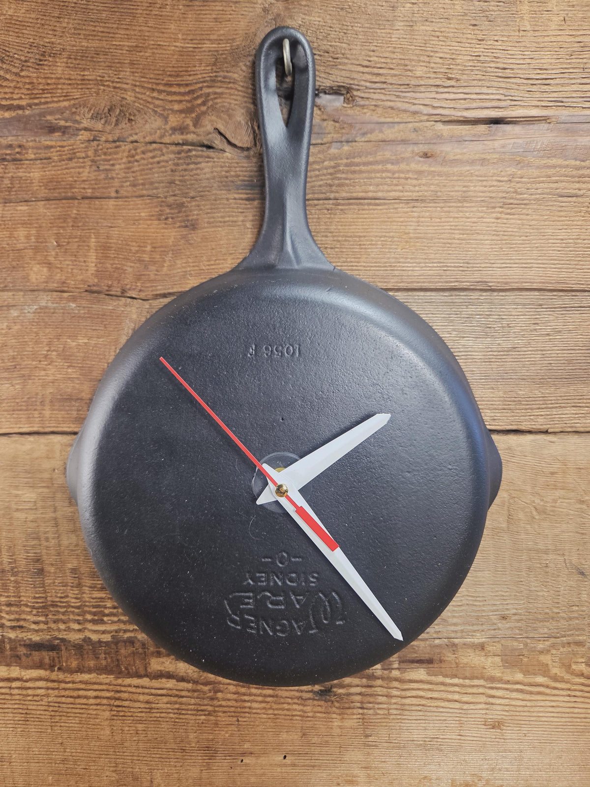 Custom made wall hanging Griswold Clock. Repurposed from cracked skillet. Comes with interchangeable clock mechanics.