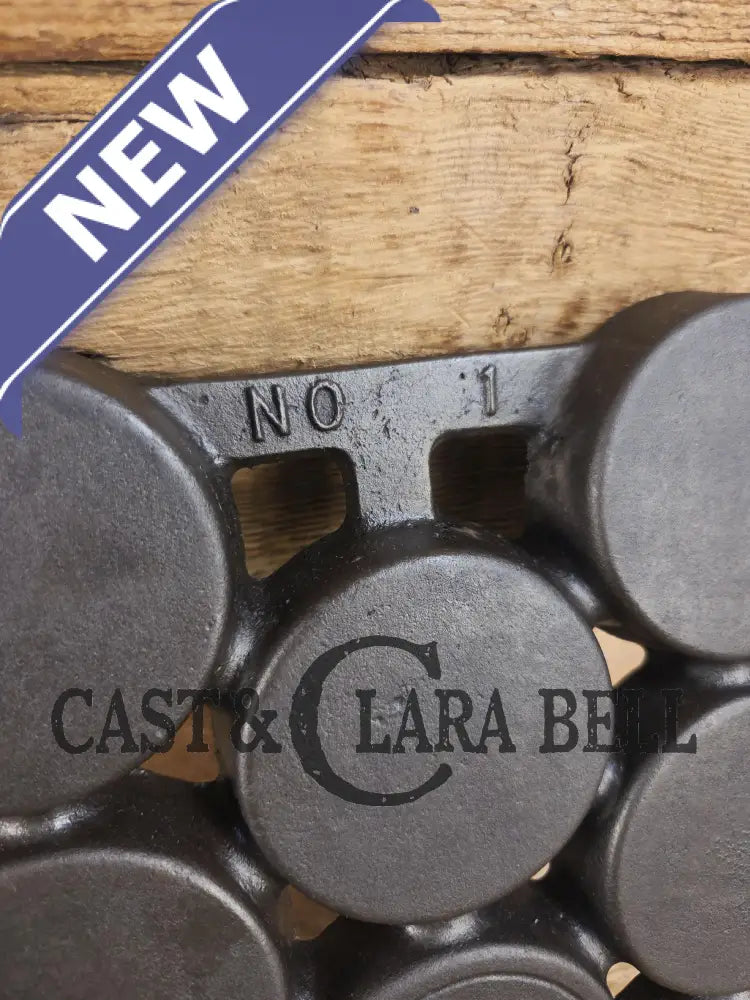 Most rare variation (Rarity 6) Fully Marked Griswold No. 1 Gem Pan Block Logo 11 cup p/n 940. This piece is flat out