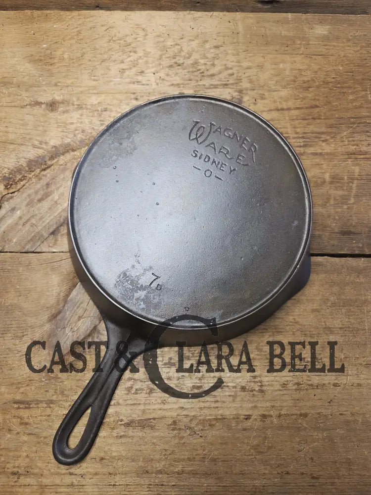 Priced to Sell! 1920’s Era Wagner Ware Sidney O. #7D Skillet with Heat Ring. Great value because of small pitted area