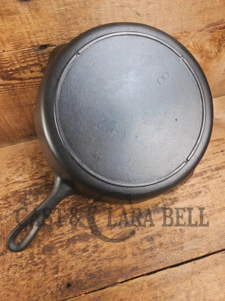 Priced to sell daily workhorse! Early 1900’s Lodge #8 Skillet with 3 Notch Heat Ring and raised RI. Great first pan!