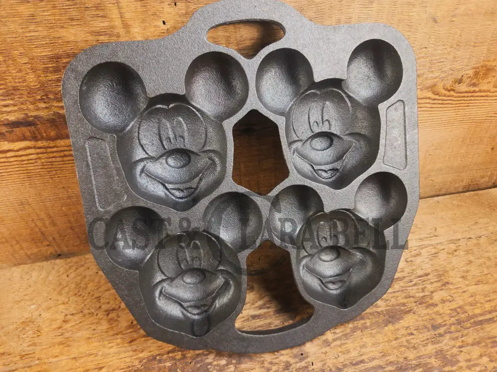 So cool! Lodge made Mickey Mouse Gem Pan. Makes great mini cakes! - Bakeware