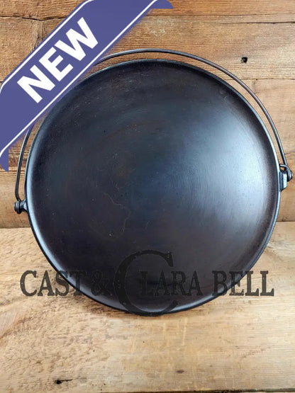 Spectacular piece! 1910’s #742 Griswold No. 14 Round Griddle w/ Bail and Slant Logo. The largest made of its kind and