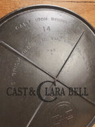 Spectacular piece! 1910’s #742 Griswold No. 14 Round Griddle w/ Bail and Slant Logo. The largest made of its kind and