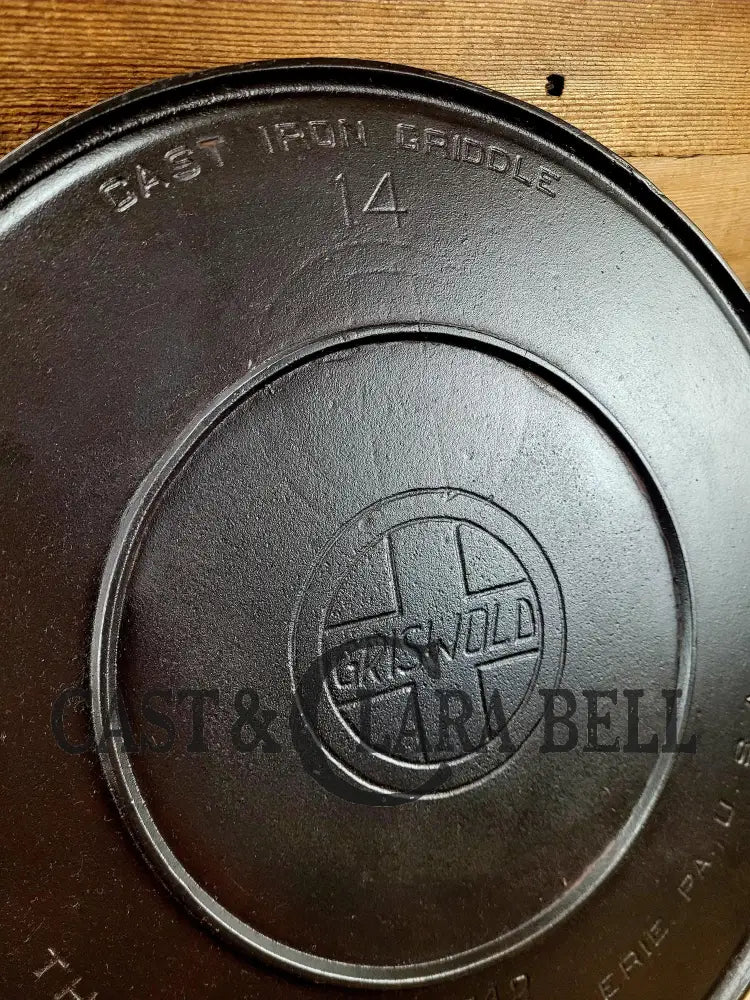 Spectacular piece! 1910’s #742 Griswold No. 14 Round Griddle w/ Bail and Slant Logo. The largest made of its kind and