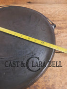 Spectacular piece! 1910’s #742 Griswold No. 14 Round Griddle w/ Bail and Slant Logo. The largest made of its kind and