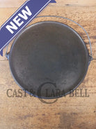 Spectacular piece! Late 1910’s #742 Griswold No. 14 Round Griddle w/ Bail and Slant Logo. The largest made of its kind