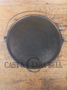 Spectacular piece! Late 1910’s #742 Griswold No. 14 Round Griddle w/ Bail and Slant Logo. The largest made of its kind