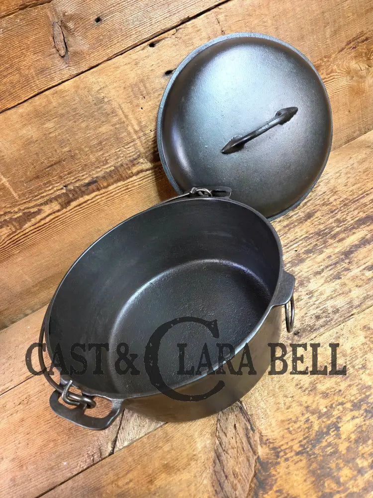 Stunning! 1930’s Favorite Piqua Ware #8 Dutch Oven with matching lid. Smiley Logo. Dutch Ovens Trivets & Kettles