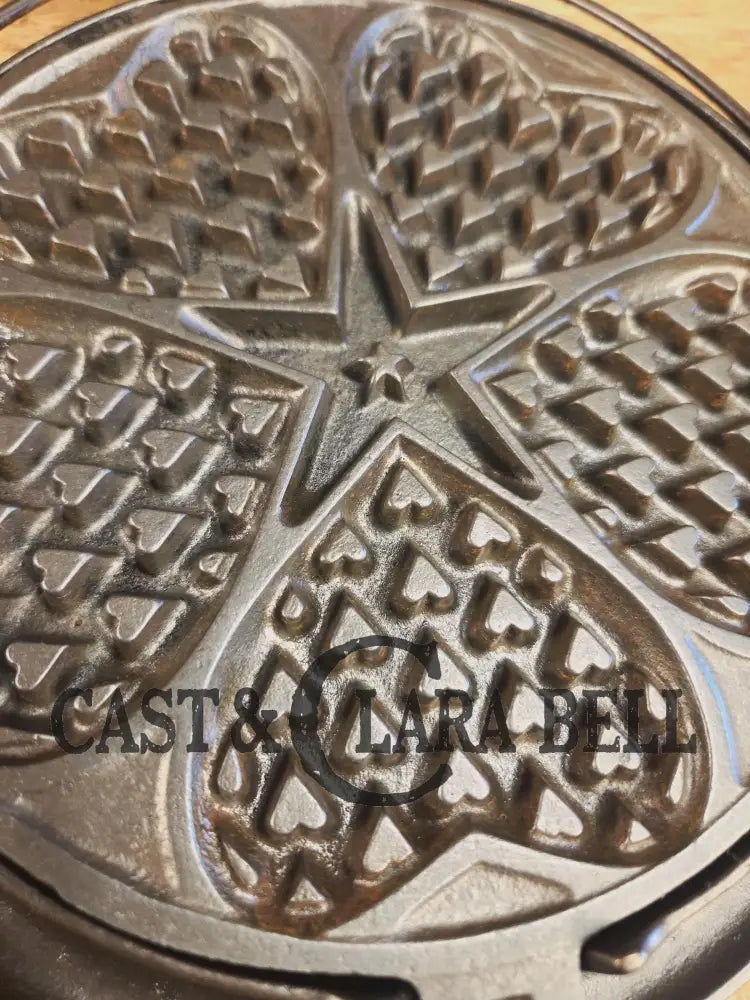 Stunning. The Premier waffle iron! Griswold No. 18 ’Heart and Star’ (919/920) Waffle Iron. Bailed Low Base. Makes the