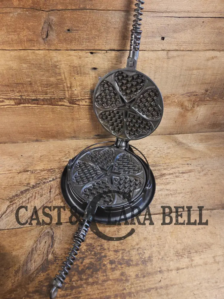 Stunning. The Premier waffle iron! Griswold No. 18 ’Heart and Star’ (919/920) Waffle Iron. Bailed Low Base. Makes the