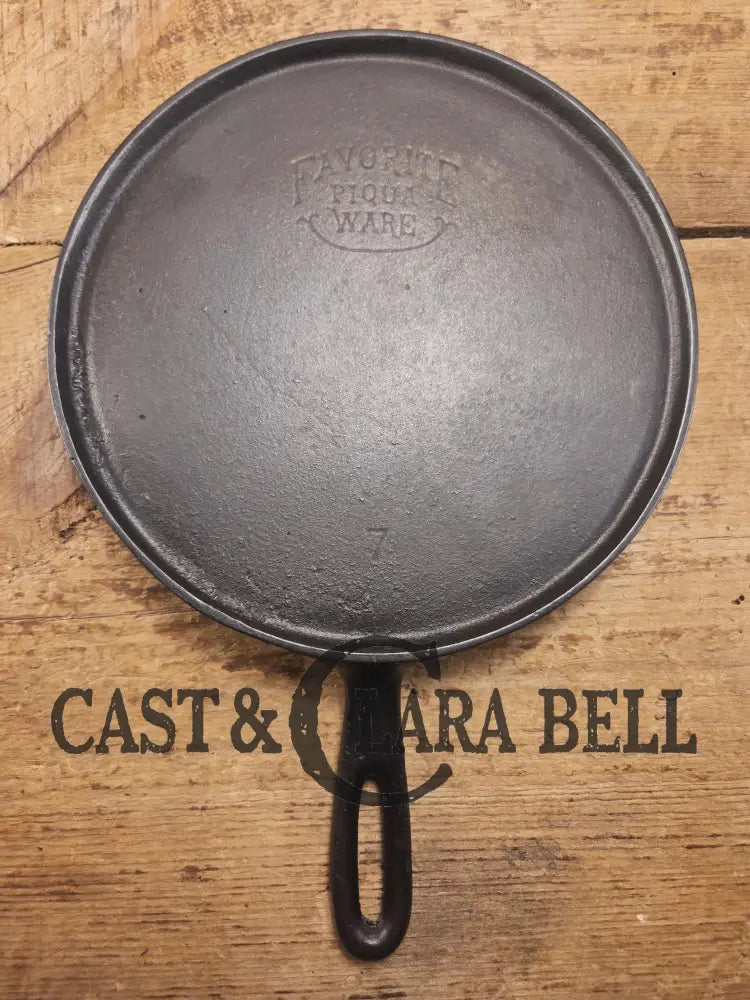 Tougher to find. 1920’s Favorite Piqua Ware #7 Round Cast Iron Griddle with Smiley Logo. Perfect grilled cheese and