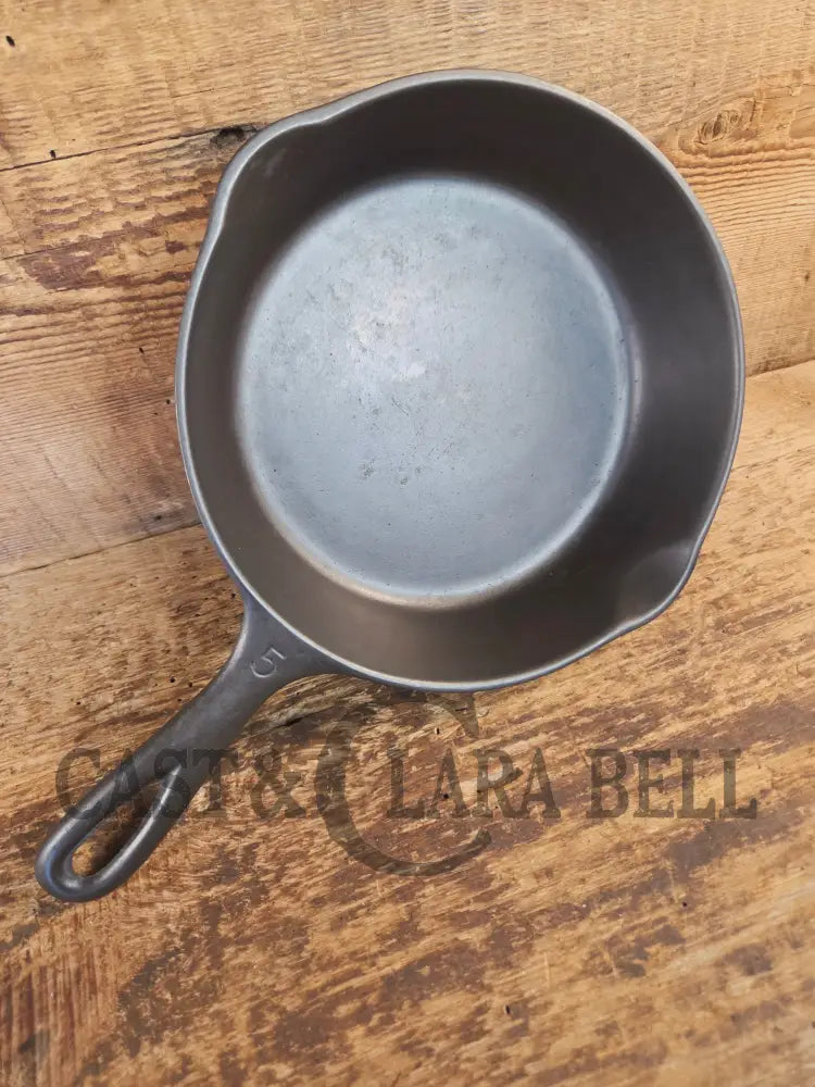 Unmarked #5 Saute Skillet with Heat Ring. An Awesome sauce pan! Looks very similar to Wagner - Skillet