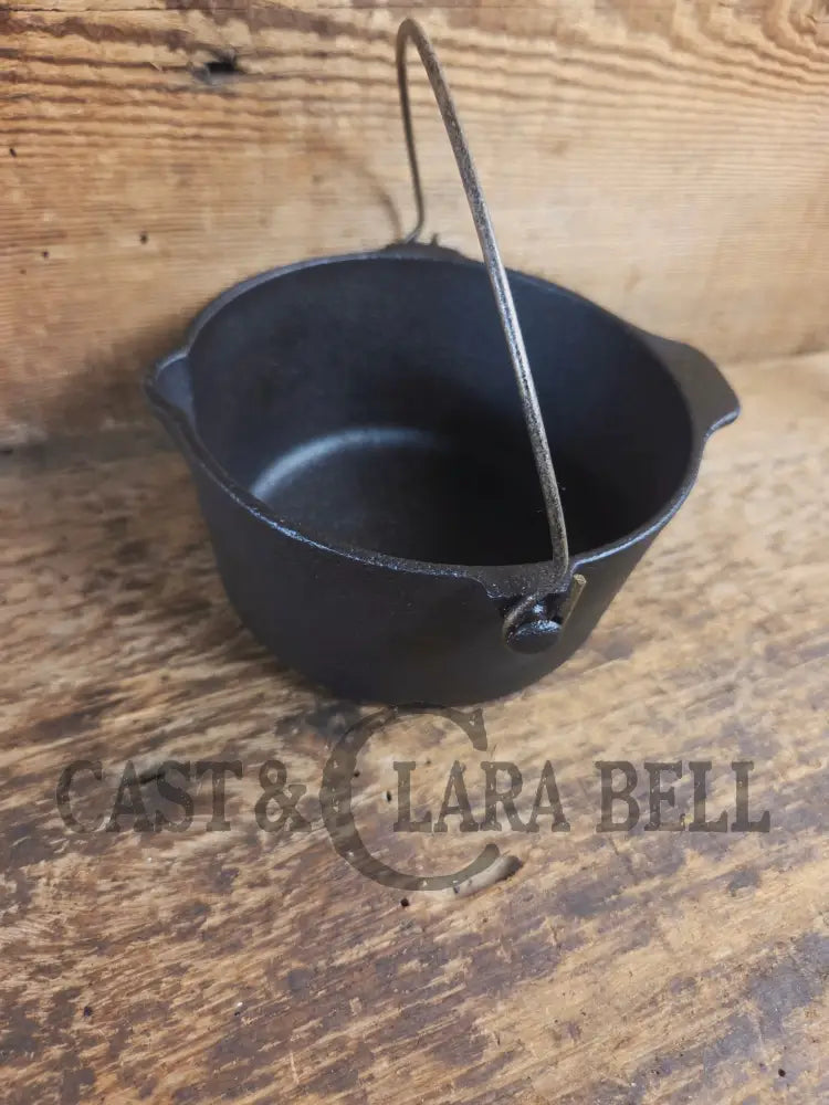 Very cool mini cast piece. 1940’s Griswold Cast Iron Patty Bowl with bailed handle. Great utility piece! - Dutch Ovens