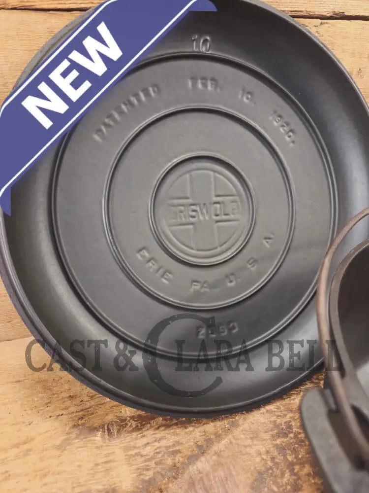 WOW. Not seen often! Griswold first series Slant Logo w/ ERIE Dutch oven Size #10 (835) Dutch Oven with ERIE Logo &